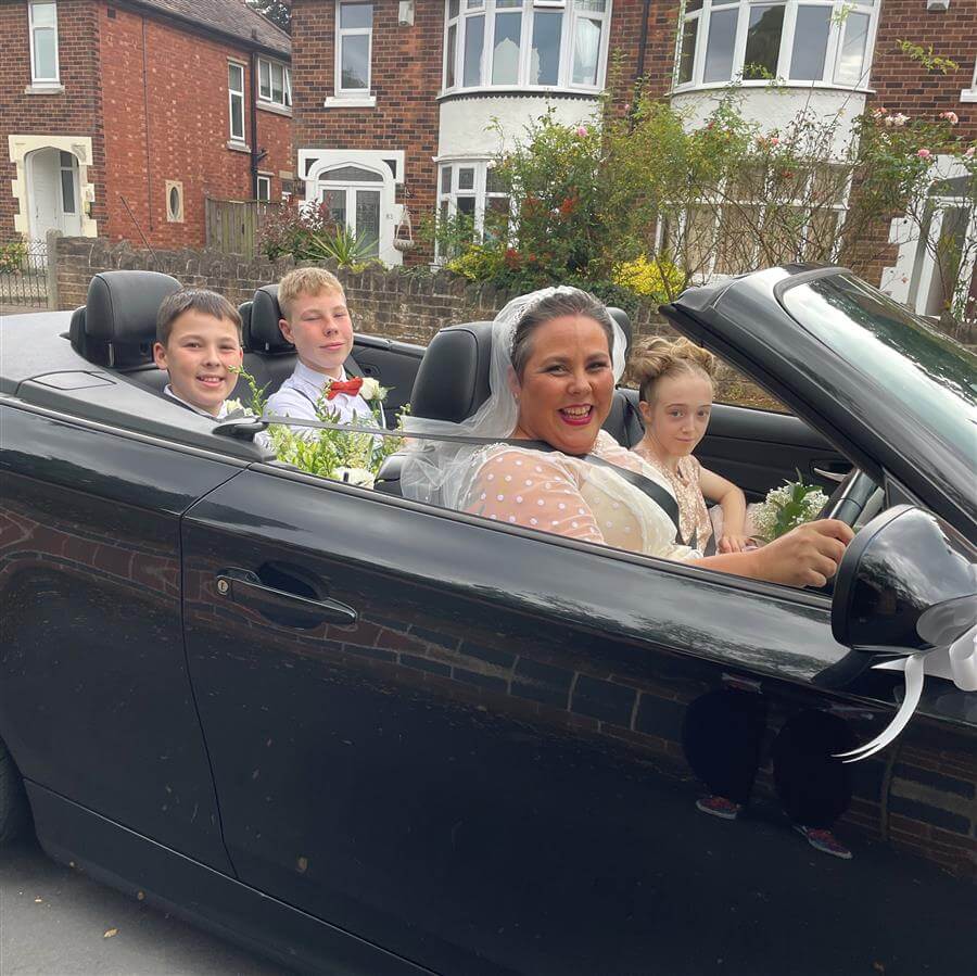 Kirsten in her wedding car